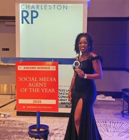 A award winning real estate agent stands before a sign